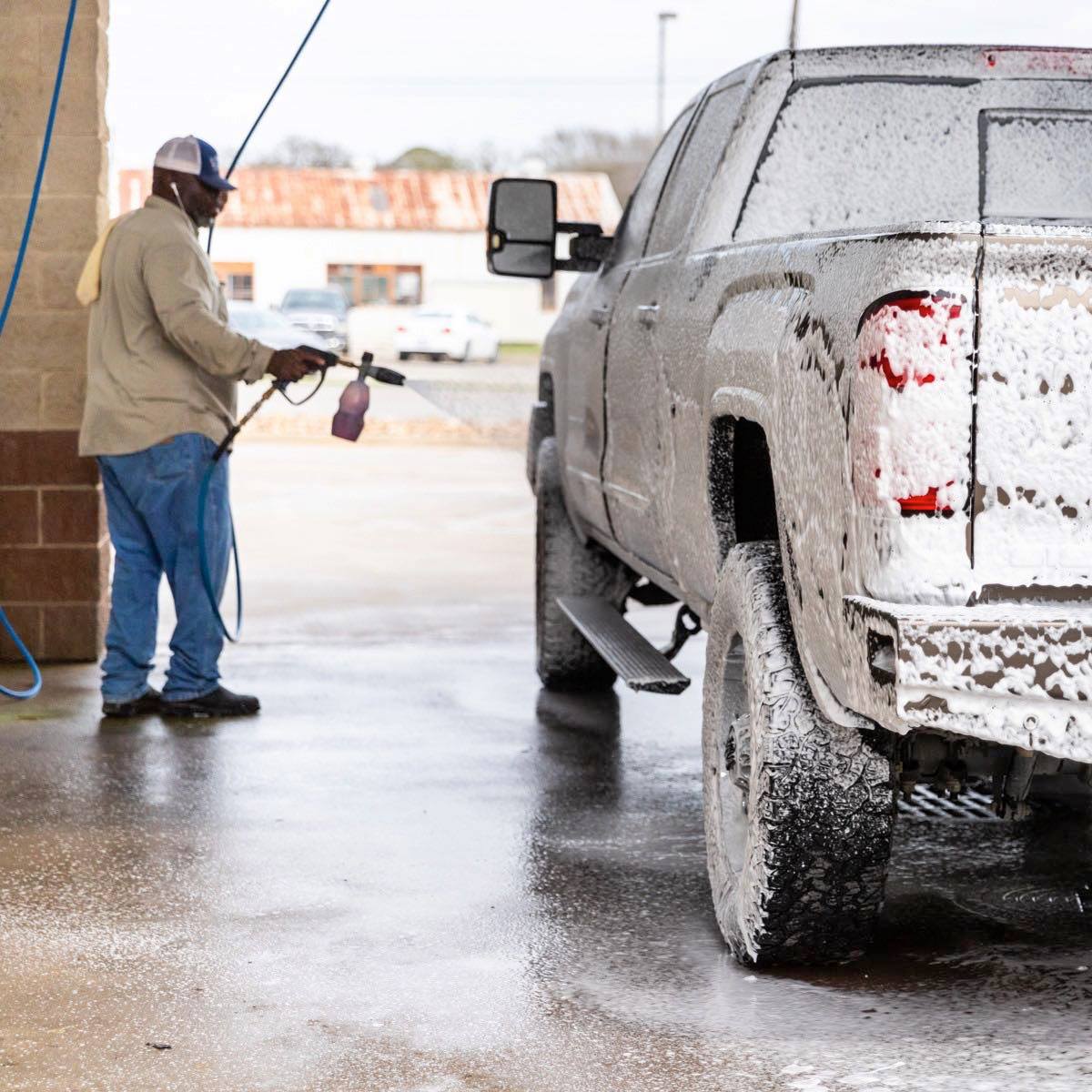 Sudz Car Wash soaping up a truck